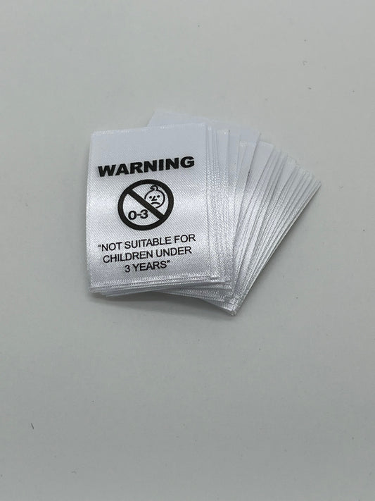 NOT SUITABLE FOR CHILDREN UNDER 3 YEARS - Garment Warning Labels